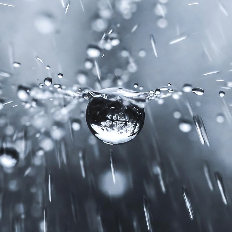 Slow droplets descend, vibrating softly